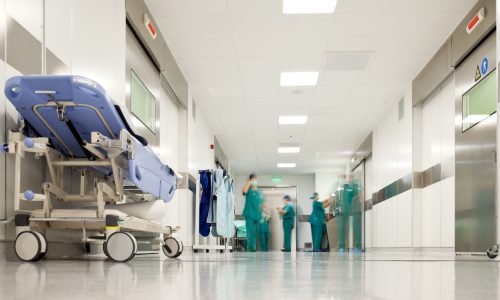 Hospital surgery corridor Blurred figures of people with medical uniforms in hospital corridor